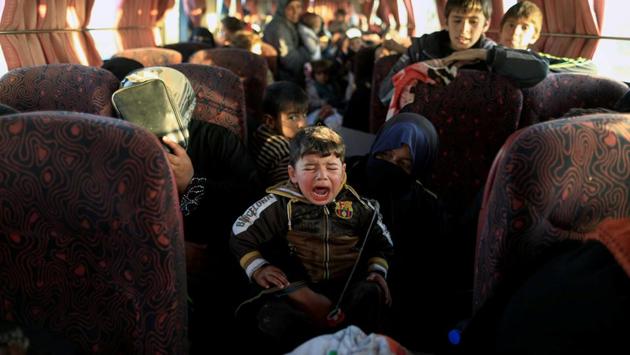 A boy, who just fled a village controlled by Islamic State fighters cries as he sits with his family inside a bus before heading to the camp at Hammam Ali south of Mosul, Iraq. (Zohra Bensemra/REUTERS) A boy, who just fled a village controlled by Islamic State fighters cries as he sits with his family inside a bus before heading to the camp at Hammam Ali south of Mosul, Iraq. (Zohra Bensemra/REUTERS)