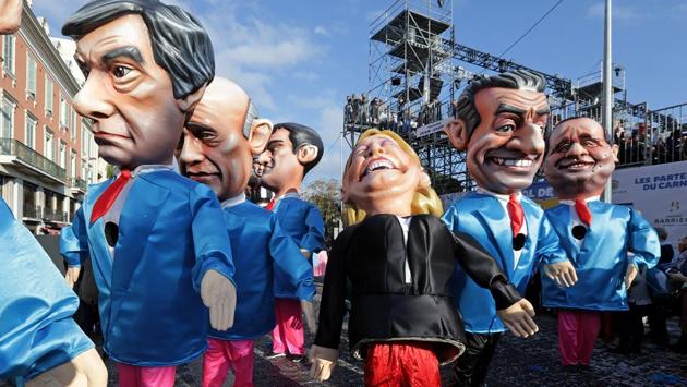 Figures of former French Prim Minister Francois Fillon (L), member of The Republicans political party and 2017 presidential candidate of the French centre-right, French National Front leader Marine Le Pen (C) and former French President Nicolas Sarkozy (R) are paraded through the crowd during the Carnival parade of the 133rd carnival, the first major event since the city was attacked during Bastille Day celebrations last year in Nice, France. (Eric Gaillard/REUTERS) Figures of former French Prim Minister Francois Fillon (L), member of The Republicans political party and 2017 presidential candidate of the French centre-right, French National Front leader Marine Le Pen (C) and former French President Nicolas Sarkozy (R) are paraded through the crowd during the Carnival parade of the 133rd carnival, the first major event since the city was attacked during Bastille Day celebrations last year in Nice, France. (Eric Gaillard/REUTERS)