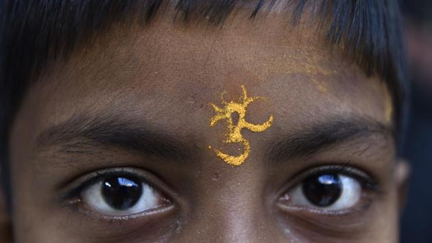 A boy pictured with a ‘tilak’ on his forehead on the occasion of Maha Shivratri at Gauri Shankar Mandir in Old Delhi. (Saumya Khandelwal/HT PHOTO) A boy pictured with a ‘tilak’ on his forehead on the occasion of Maha Shivratri at Gauri Shankar Mandir in Old Delhi. (Saumya Khandelwal/HT PHOTO)