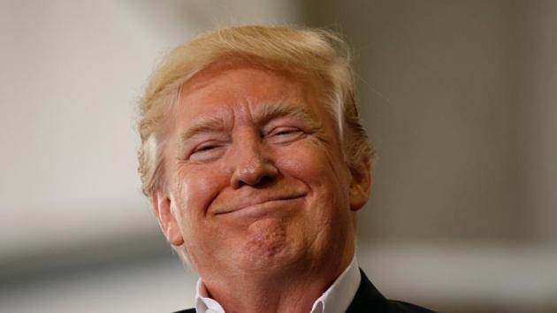US President Donald Trump smiles as he holds a "Make America Great Again" rally at Orlando Melbourne International Airport in Melbourne. (REUTERS Photo) US President Donald Trump smiles as he holds a "Make America Great Again" rally at Orlando Melbourne International Airport in Melbourne. (REUTERS Photo)