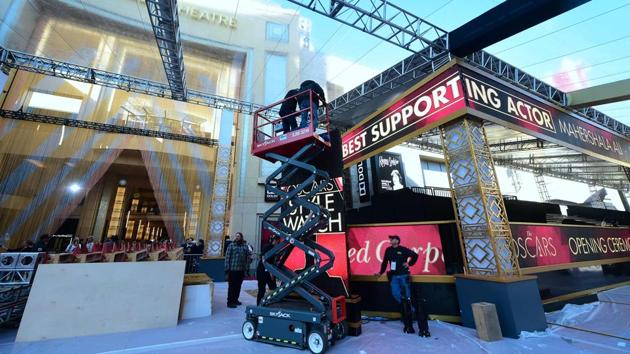Scenic artists work on the red carpet February 24, 2017 in Hollywood, California. (AFP)