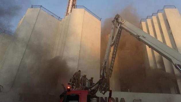 Firemen douse flames at the Times of India building in Bahadur Shah Zafar Marg. (Burhan Kinu/ HT Photo) Firemen douse flames at the Times of India building in Bahadur Shah Zafar Marg. (Burhan Kinu/ HT Photo)