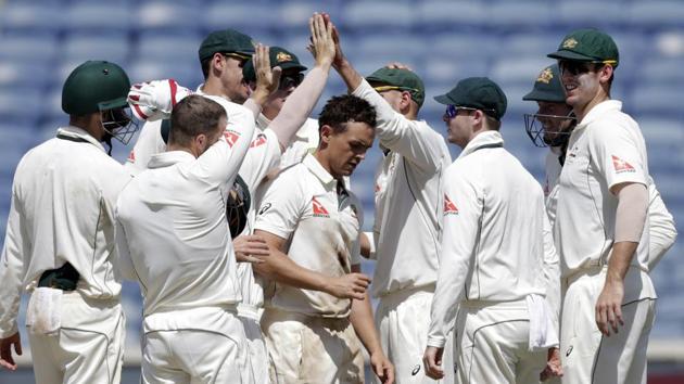 Australia spinner Steve O'Keefe’s (centre) match haul of 12/70 in the first Test against India in Pune was dubbed a ‘superhero performance’ by the media.(AP)