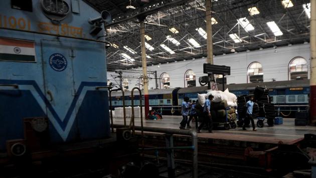 Indian railways workers use a cart to transport goods through a train station in Chennai on Febuary 1. (AFP Photo) Indian railways workers use a cart to transport goods through a train station in Chennai on Febuary 1. (AFP Photo)