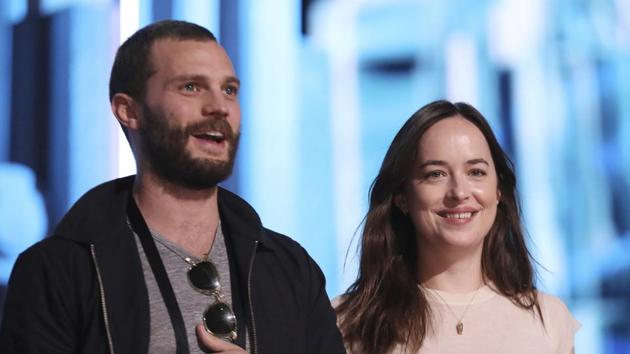 Jamie Dornan and Dakota Johnson prepare for their part. (Matt Sayles/Invision/AP)