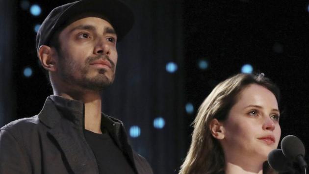 Riz Ahmed, left, and Felicity Jones take their duties seriously. (Matt Sayles/Invision/AP)