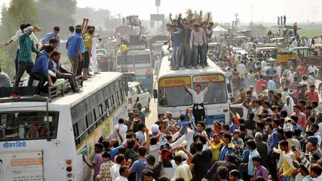Jat protesters block traffic on the Panipat- Rohtak national highway during their agitation for reservation at Jassia village in Rohtak. (PTI Photo) Jat protesters block traffic on the Panipat- Rohtak national highway during their agitation for reservation at Jassia village in Rohtak. (PTI Photo)