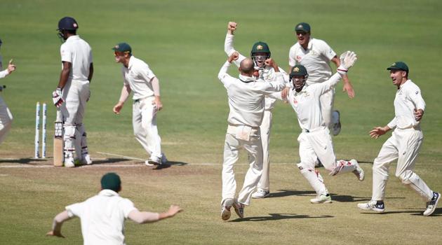 Australian cricket team players celebrate after defeating Indian cricket team in the first Test.(PTI)