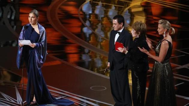 89th Academy Awards - Oscars Awards Show - Hollywood, California, U.S. - 26/02/17 - Best Foreign Language Film The Salesman Asghar Farhadi (Iran) is accepted by a designated woman reading Farhadi's statement.(Reuters Photo)