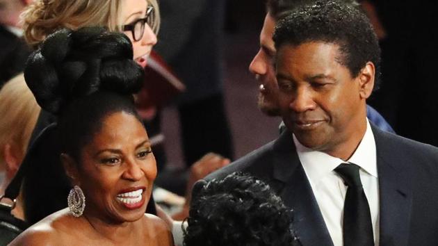 Actor Denzel Washington and wife Pauletta on the red carpet. (REUTERS)