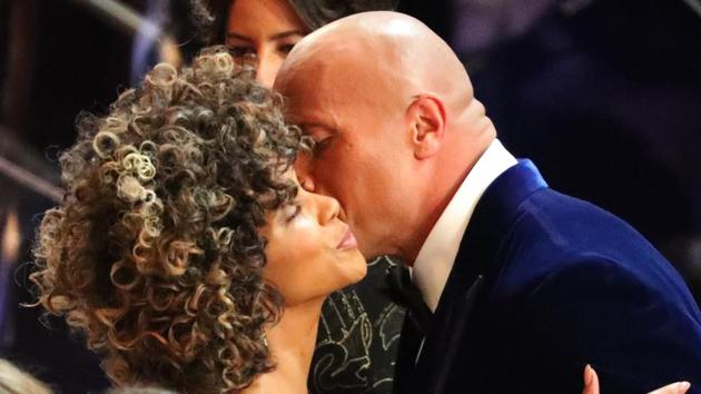 Halle Berry greets Dwayne Johnson on the red carpet. (REUTERS)
