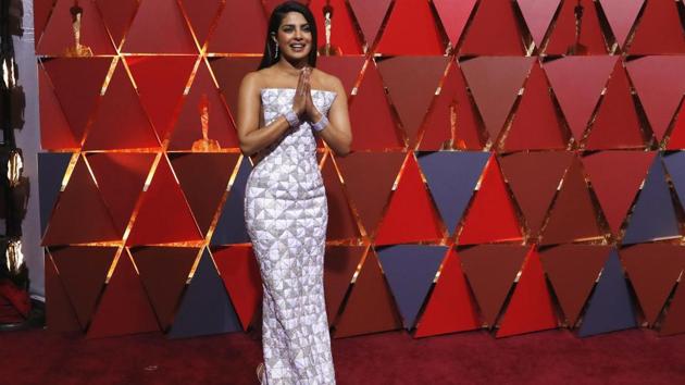 Priyanka Chopra gestures on the red carpet. (REUTERS)