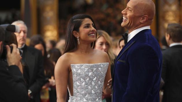 Priyanka Chopra and Dwayne Johnson on the red carpet at the Academy Awards. (REUTERS)