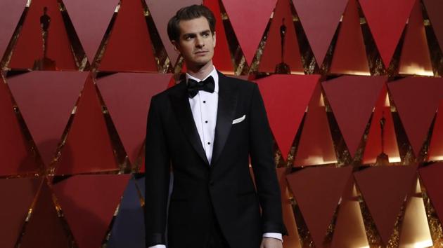 Actor Andrew Garfield poses for shutterbugs at the red carpet at the Academy Awards in Los Angeles on Monday. (REUTERS)