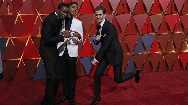 Actors Ashton Sanders (left) and Jharrel Jerome (centre) from Moonlight joke with actor Andrew Garfield (right). (REUTERS)