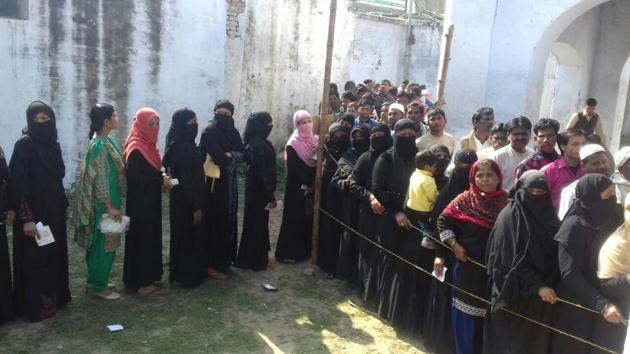 Women stand at a polling booth in Bahraich, Uttar Pradesh. (HT Photo) Women stand at a polling booth in Bahraich, Uttar Pradesh. (HT Photo)
