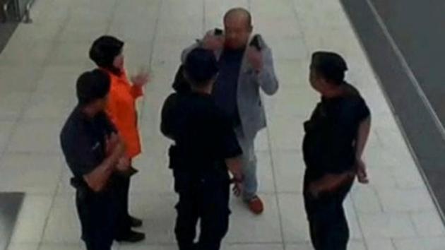 A grab from a CCTV footage appears to show a man believed to be Kim Jong Nam talking to security personnel after being accosted by a woman in a white shirt, at Kuala Lumpur International Airport in Malaysia. (Reuters file photo) A grab from a CCTV footage appears to show a man believed to be Kim Jong Nam talking to security personnel after being accosted by a woman in a white shirt, at Kuala Lumpur International Airport in Malaysia. (Reuters file photo)