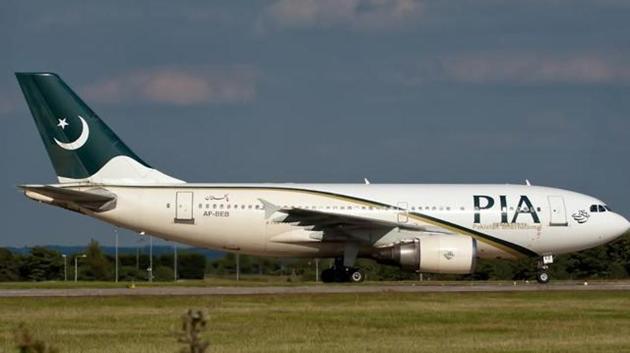 A PIA flight allegedly allowed extra passengers who stood in the aisle for the three-hour journey. (File Photo) A PIA flight allegedly allowed extra passengers who stood in the aisle for the three-hour journey. (File Photo)