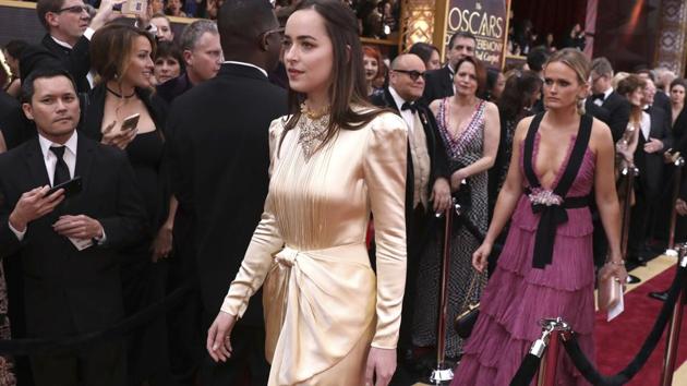 Dakota Johnson arrives at the Oscars ceremony in Los Angeles on Monday. (AP)