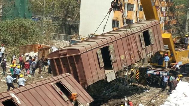 Railway authorities are clearing the tracks to resume services on the suburban line. (Vijayanand Gupta/ HT Photo)