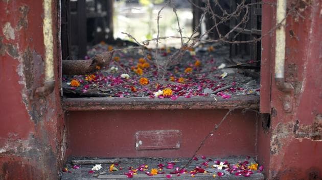 Flower petals scattered by the relatives of Godhra riots victims pictured at the doorsteps of a train carriage, that was set on fire in 2002, during the commemoration of the 12th anniversary of Godhra riots at Godhra, Gujarat(REUTERS) Flower petals scattered by the relatives of Godhra riots victims pictured at the doorsteps of a train carriage, that was set on fire in 2002, during the commemoration of the 12th anniversary of Godhra riots at Godhra, Gujarat(REUTERS)