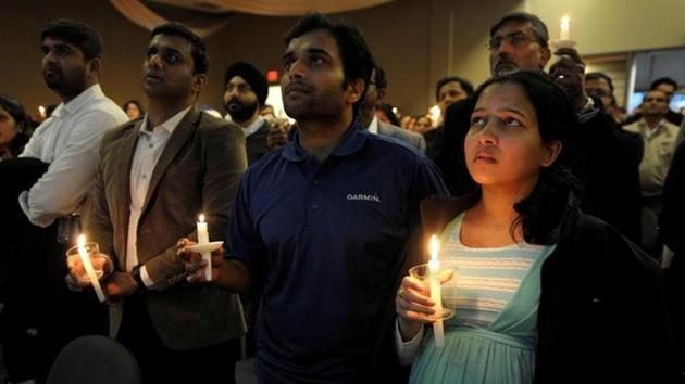 Alok Madasani and his wife Reepthi Gangula at the candlelight vigil for Srinivas Kuchibhotla in Olathe, Kansas, on Sunday.(Reuters)