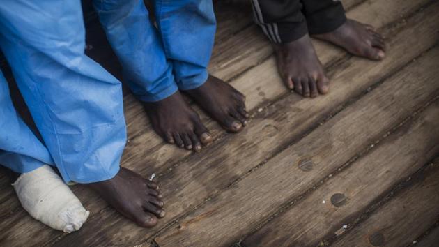 The vast majority of migrants and refugees reaching Italy are from Africa. The Italian government is considering a plan to oblige them to work. (Santi Palacios / AP)