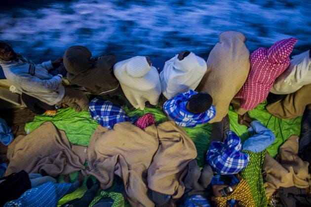 Rescuers found 332 people in three separate rubber boats travelling north of the Libyan coast, according to Proactiva Open Arms, the non -profit that operates the Golfo Azzurro rescue vessel. (Santi Palacios / AP)