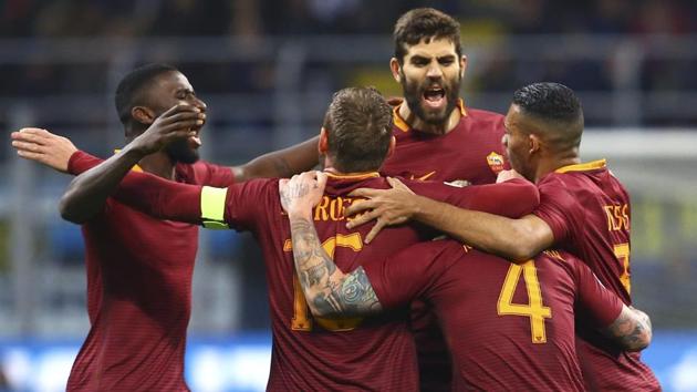 AS Roma's Radja Nainggolan celebrates with teammates after scoring against Inter Milan in their Serie A match. (REUTERS) AS Roma's Radja Nainggolan celebrates with teammates after scoring against Inter Milan in their Serie A match. (REUTERS)