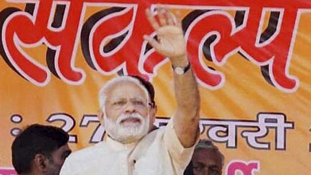 Prime Minister Narendra Modi waves to the crowd at an election rally at Mau in Uttar Pradesh on Monday.(PTI Photo) Prime Minister Narendra Modi waves to the crowd at an election rally at Mau in Uttar Pradesh on Monday.(PTI Photo)
