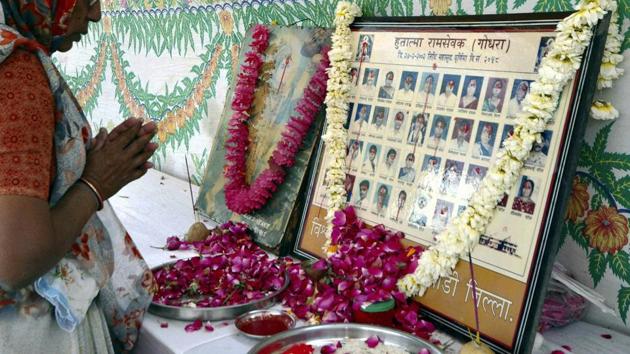 A relative of Godhra victims pray during the anniversary of Godhra carnage in Ahmedabad. More than 1,000 people, the large majority of who were from the minority Muslim community, were killed. (PTI FILE Photo)