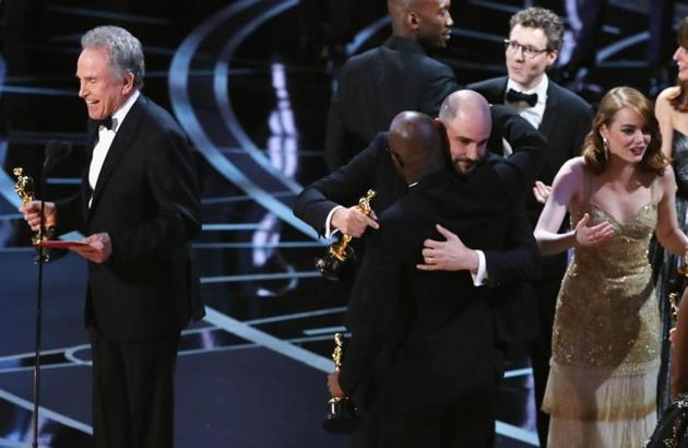 Warren Beatty speaks as Jordan Hurwitz hugs Moonlight director Barry Jenkins during presentation of Best Picture. (Reuters) Warren Beatty speaks as Jordan Hurwitz hugs Moonlight director Barry Jenkins during presentation of Best Picture. (Reuters)
