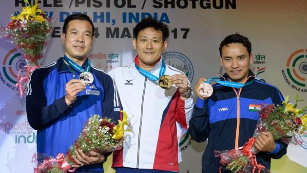 Jitu Rai (right) with 10m air pistol gold medallist Tomoyuki Matsuda (centre) and silver medallist Vinh Xuan Hoang at the ISSF World Cup. (ISSF) Jitu Rai (right) with 10m air pistol gold medallist Tomoyuki Matsuda (centre) and silver medallist Vinh Xuan Hoang at the ISSF World Cup. (ISSF)