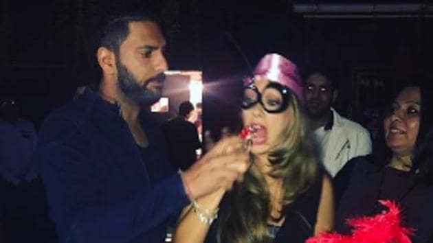 Yuvraj Singh feeds Hazel Keech a piece of her birthday cake during the party on Monday night. His friend and teammate Harbhajan Singh was also part of the fun. (Yuvraj Singh Instagram (@yuvisofficial)) Yuvraj Singh feeds Hazel Keech a piece of her birthday cake during the party on Monday night. His friend and teammate Harbhajan Singh was also part of the fun. (Yuvraj Singh Instagram (@yuvisofficial))
