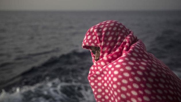 A migrant rests aboard Golfo Azurro, the Spanish NGO Proactiva Open Arms rescue ship, off the Libyan coast. (AP Photo) A migrant rests aboard Golfo Azurro, the Spanish NGO Proactiva Open Arms rescue ship, off the Libyan coast. (AP Photo)