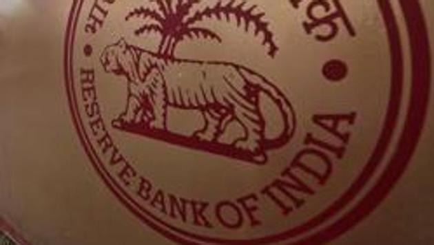 A logo of the Reserve Bank of India (RBI) in front of its building in Kolkata.(REUTERS)