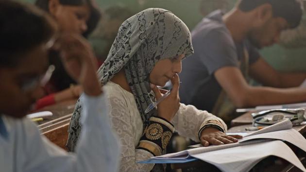 At a centre in Charkop, a student finishes up her paper. (Pratham Gokhale/HT PHOTO) 