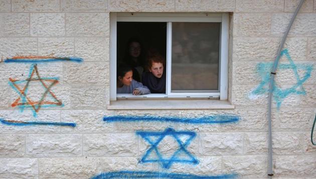 Israeli youths supporters of settlements gather inside a house in the settlement of Ofra in the occupied West Bank, during an operation by Israeli police to evacuate settlers' houses, on February 28. (AFP Photo) Israeli youths supporters of settlements gather inside a house in the settlement of Ofra in the occupied West Bank, during an operation by Israeli police to evacuate settlers' houses, on February 28. (AFP Photo)