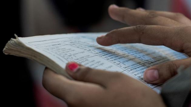 A student brushes through her lessons just before the exam begins, outside a centre at Vile Parle in Mumbai. (Satish Bate/HT PHOTO) 