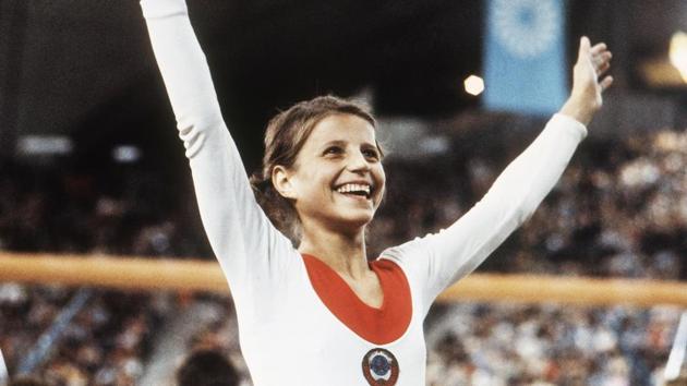 In this August 1972 file photo, Olga Korbut of Russia, throws up her arms in joy after winning the individual women's gymnastic event at the 1972 Summer Olympics in Munich. At 61, Korbut enjoys a quiet life in Arizona.(AP)