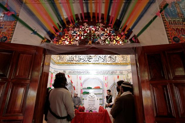 Mumtaz Qadri’s followers at the shrine built over his grave, on the outskirts of Islamabad. (Reuters) Mumtaz Qadri’s followers at the shrine built over his grave, on the outskirts of Islamabad. (Reuters)