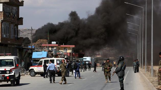 Smoke rises from a district police headquarters after the suicide bombing in Kabul on Wednesday.(AP)