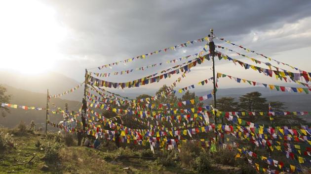 Tibetans believe that the prayer flags representing the five elements: earth, fire, sky, water and wind, spread prayers with the wind. (Ashwini Bhatia / AP) Tibetans believe that the prayer flags representing the five elements: earth, fire, sky, water and wind, spread prayers with the wind. (Ashwini Bhatia / AP)