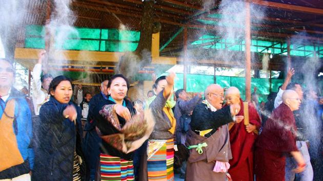 Tibetans throw white flour powder in air during a prayer session as part of ‘Losar’ celebration. (Shyam Sharma / HT Photo) Tibetans throw white flour powder in air during a prayer session as part of ‘Losar’ celebration. (Shyam Sharma / HT Photo)