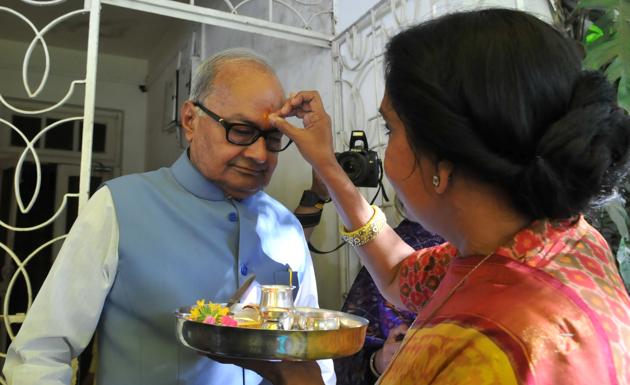 Bhopal, India - March 1, 2017: Wife Sudha Malaiya applying tilak on the forehead of finance minister Jayant Malaiya before he left his bungalow to present the state budget in MP state assembly at Bhopal on Wednesday, March 1, 2017. (Mujeeb Faruqui/HT PHOTO) Bhopal, India - March 1, 2017: Wife Sudha Malaiya applying tilak on the forehead of finance minister Jayant Malaiya before he left his bungalow to present the state budget in MP state assembly at Bhopal on Wednesday, March 1, 2017. (Mujeeb Faruqui/HT PHOTO)