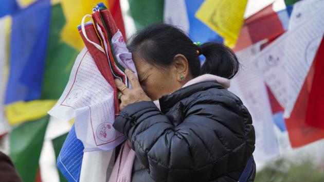 Tibetans celebrated the third day of the Firebird year by tying multicoloured prayer flags on high poles and praying. (Ashwini Bhatia / AP) Tibetans celebrated the third day of the Firebird year by tying multicoloured prayer flags on high poles and praying. (Ashwini Bhatia / AP)