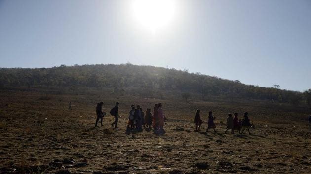 Tribal family members make their way around the hilly landscape of Nyamgiri to attend the festivities. (Arabinda Mohapatra) Tribal family members make their way around the hilly landscape of Nyamgiri to attend the festivities. (Arabinda Mohapatra)