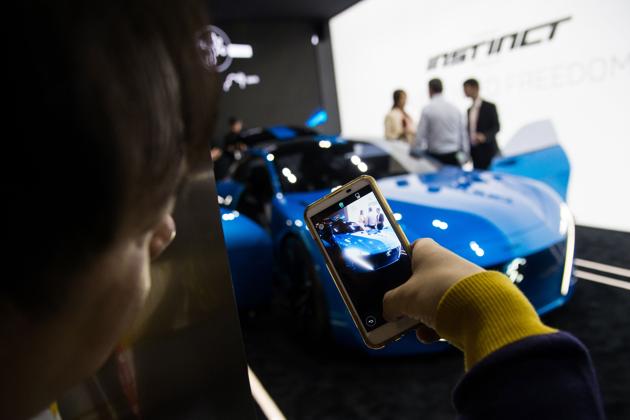 A visitor takes a picture of Peugeot car "Instinct" connected by Samsung technology at the Mobile World Congress on the first day of the MWC in Barcelona, on February 27, 2017. Phone makers will seek to seduce new buyers with artificial intelligence functions and other innovations at the world's biggest mobile fair starting today in Spain. (AFP) A visitor takes a picture of Peugeot car "Instinct" connected by Samsung technology at the Mobile World Congress on the first day of the MWC in Barcelona, on February 27, 2017. Phone makers will seek to seduce new buyers with artificial intelligence functions and other innovations at the world's biggest mobile fair starting today in Spain. (AFP)