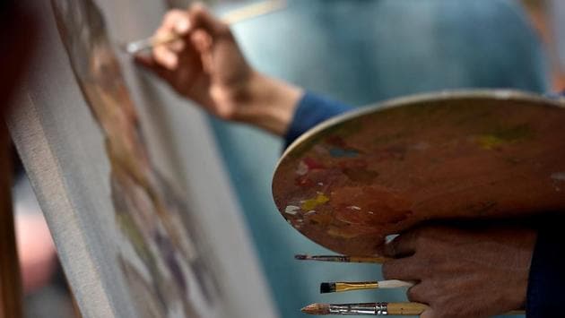 NOT BRUSHING IT OFF: An artist makes a point. (Arijit Sen/HT Photo) 
