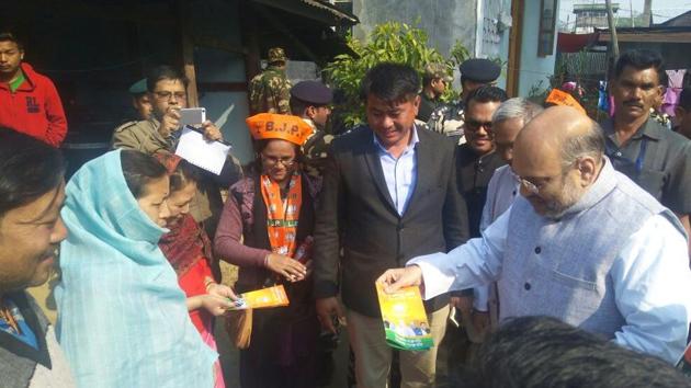 BJP chief Amit Shah during his door to door campaign in Imphal. (HT Photo) BJP chief Amit Shah during his door to door campaign in Imphal. (HT Photo)